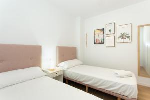 A bed or beds in a room at Edificio Peñiscola