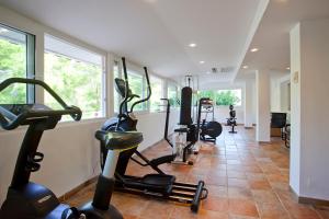 a gym with several exercise bikes in a room at Hotel Cala Sant Vicenç - Adults Only in Cala de Sant Vicenc