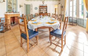 a dining room with a table and chairs at 10 Bedroom Cozy Home In Allonne in Beauvais