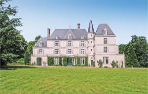 a large white house with a large grass field at Nice Home In Allonne With 10 Bedrooms And Wifi in Beauvais