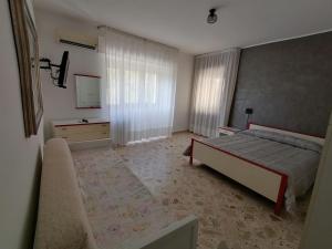 A bed or beds in a room at Al Belvedere