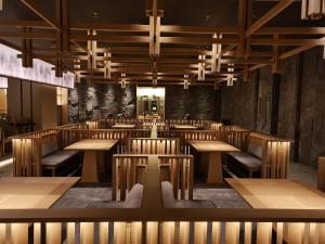 an empty restaurant with wooden tables and chairs at Wanda Jin Xiaohe Xincheng in Taiyuan