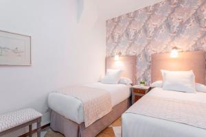 Posteľ alebo postele v izbe v ubytovaní Genteel Home Campamento