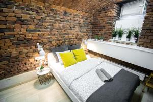 Posteľ alebo postele v izbe v ubytovaní LION apartments
