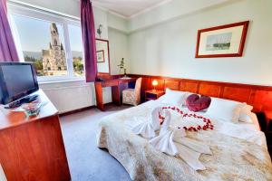 Posteľ alebo postele v izbe v ubytovaní Hotel Irottkö