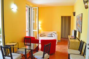 a living room with a couch and a table and chairs at Villachiara in Silvi Marina