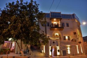 a building with solar panels on top of it at La Perla Cave Cappadocia in Urgup