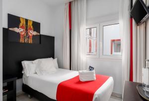 Postel nebo postele na pokoji v ubytování Hotel Del Pintor
