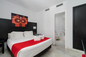 Postel nebo postele na pokoji v ubytování Hotel Del Pintor
