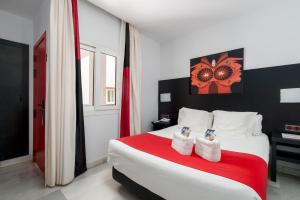 Postel nebo postele na pokoji v ubytování Hotel Del Pintor