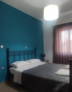 Posteľ alebo postele v izbe v ubytovaní VASO'S APARTMENTS