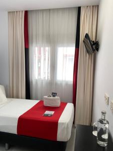 Postel nebo postele na pokoji v ubytování Hotel Del Pintor