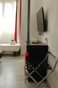 TV a/nebo společenská místnost v ubytování Hotel Del Pintor