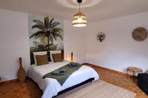 Ένα ή περισσότερα κρεβάτια σε δωμάτιο στο La Cousinade