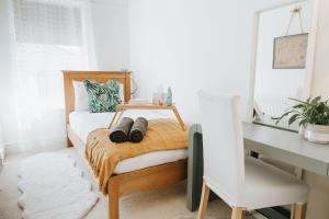 a bedroom with a bed with a desk and a desk at 3 Bed - Modern Comfortable Stay - Preston City Centre in Preston