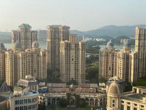 a view of a large city with tall buildings at Maxxvalue Apartment Hiranandani Powai - RH5 in Mumbai