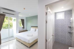 Postel nebo postele na pokoji v ubytování Green Hotel Phuket