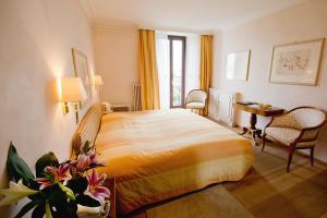 Voodi või voodid majutusasutuse Romantik Hotel Castello Seeschloss toas