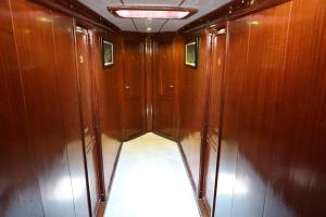 an empty corridor of a boat with wooden walls at Feronia teknesi in Fethiye