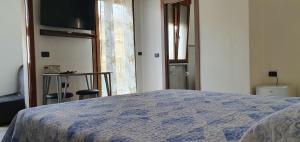 A bed or beds in a room at Le Rustiche Foresteria