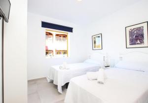 Postel nebo postele na pokoji v ubytování Apartment Goleta + 2 fotografie