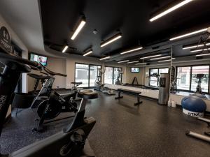 a gym with several treadmills and exercise bikes at Hôtel Québec Best Western PLUS Centre-Ville - City Center in Quebec City