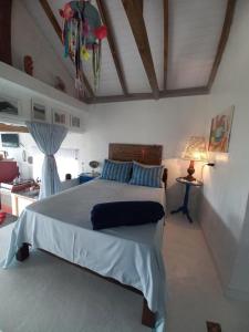 Llit o llits en una habitació de Apartamento Praia da Gamboa - Cabanas da Candoca Vista para o Mar