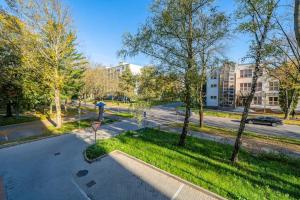 an empty street with trees and a parking lot at Style apartment studio Kabeny in Michalovce