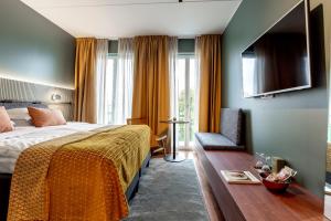 TV a/nebo společenská místnost v ubytování Elite Stadshotellet Karlstad, Hotel & Spa