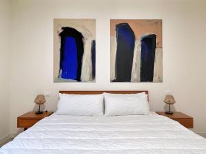 Posteľ alebo postele v izbe v ubytovaní UR NEST San Giorgio