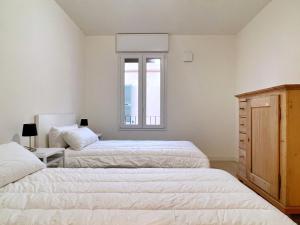 Posteľ alebo postele v izbe v ubytovaní UR NEST San Giorgio