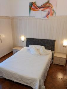 Postel nebo postele na pokoji v ubytování Hotel Montecarlo