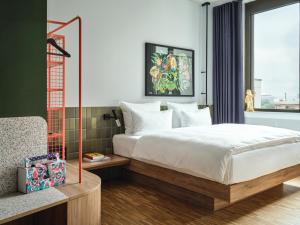 Postel nebo postele na pokoji v ubytování URBAN LOFT Berlin