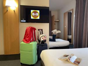 Postel nebo postele na pokoji v ubytování B&B HOTEL Metz Est Technopole Pôle Santé