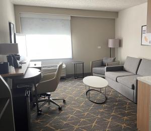 a living room with a couch and a table at Holiday Inn Hotel & Suites Chicago - Downtown, an IHG Hotel in Chicago