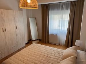 a bedroom with a large bed and a window at MoMA Meanas Aviles Centro in Avilés