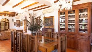 a tasting room with a large wooden table and chairs at Finca la Cañera Alcalá de Guadaira by Ruralidays in Alcalá de Guadaira