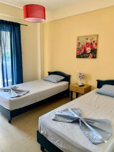 Posteľ alebo postele v izbe v ubytovaní Nikol Apartments