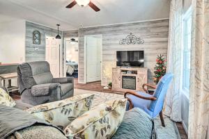 a living room with a couch and chairs and a television at Charming Blue Knob Home Near Golfing and Skiing 