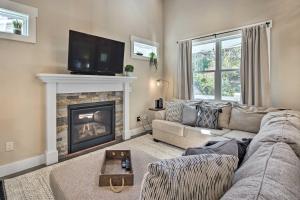 a living room with a couch and a fireplace at Charming Asheville House with Private Yard! in Asheville