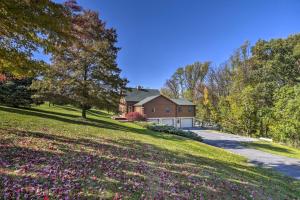 a house on a hill with a driveway at Beautiful Mount Joy Cabin with Pool and Sauna! in Mount Joy