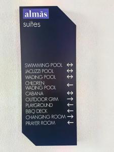 a black sign with white writing on a wall at C1110 Almas Suites Galaxy Space Netflix By STAY in Nusajaya