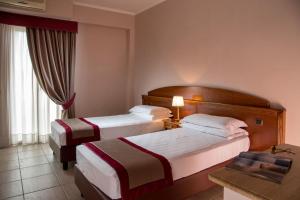 Postel nebo postele na pokoji v ubytování Marini Park Hotel