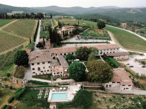 an aerial view of a mansion in a vineyard at Wine Resort Dievole in Vagliagli