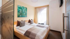 A bed or beds in a room at Apart Albore