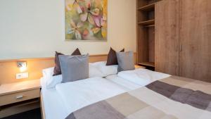 Ein Bett oder Betten in einem Zimmer der Unterkunft Apart Albore
