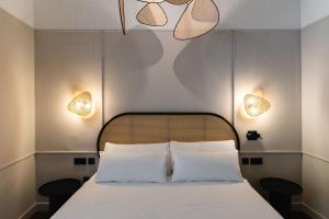 Posteľ alebo postele v izbe v ubytovaní ORA Hotel Priorat, a Member of Design Hotels