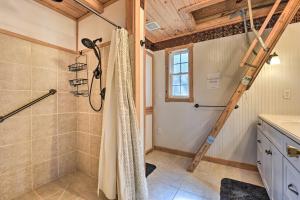 a bathroom with a shower and a ladder at Idyllic Cabin with Fire Pit, Kayak On-Site! in Bells +23 photos