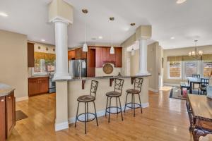 a kitchen with two bar stools and a counter at Osprey Cove in Moneta