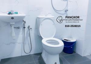 a bathroom with a toilet and a sink at Pangkor Pasir Bogak Apartment 2Rooms 2Bathrooms near beach 6pax FREE WIFI in Pangkor
